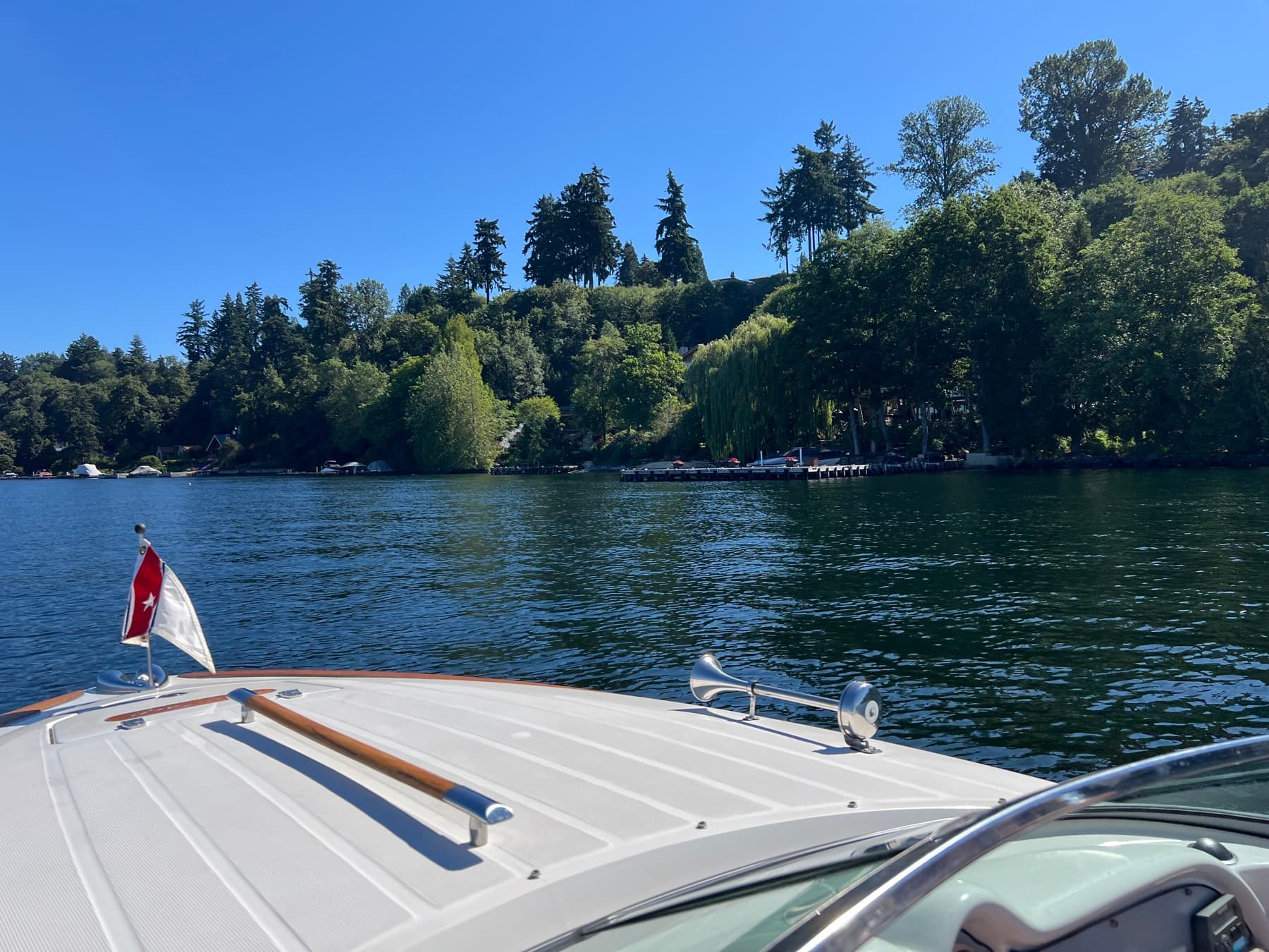 The bow of a Chris-Craft pointed across Lake Sammamish